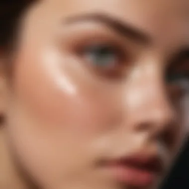 Close-up of a person applying concealer under the eyes