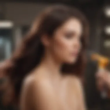 A hairdresser applying heat protectant spray to model's hair