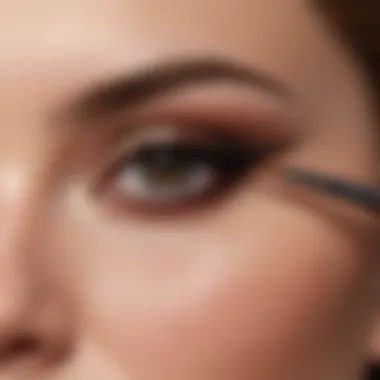 Close-up of a hand applying matte eyeshadow with a brush for a flawless finish.