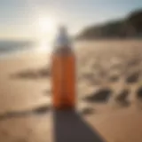 Sleek bottle of Beauty Counter sunscreen spray on a sunlit beach