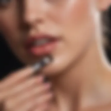 Close-up of a brush applying a nourishing nail polish on a nail