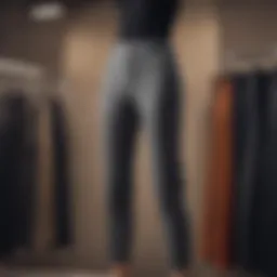 A display of high fashion pants in a boutique setting, showcasing various styles and fabrics.