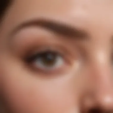 Close-up view of perfectly shaped eyebrows after peel off treatment