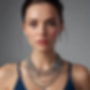 A close-up of a woman wearing layered necklaces