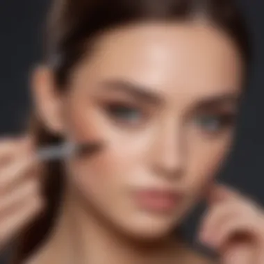 A makeup artist demonstrating brow application techniques on a model.