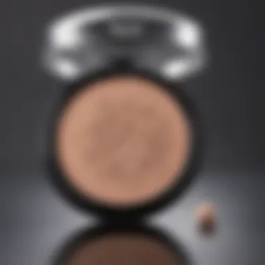 Essential Setting Powder for a Natural Finish A compact powder and a puff, essential for setting makeup.