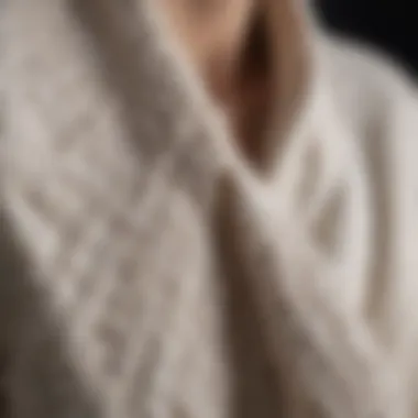 Close-up of the fabric texture of a white cardigan